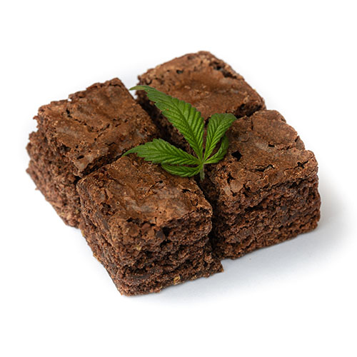 Chocolate brownies with cannabis flower on top