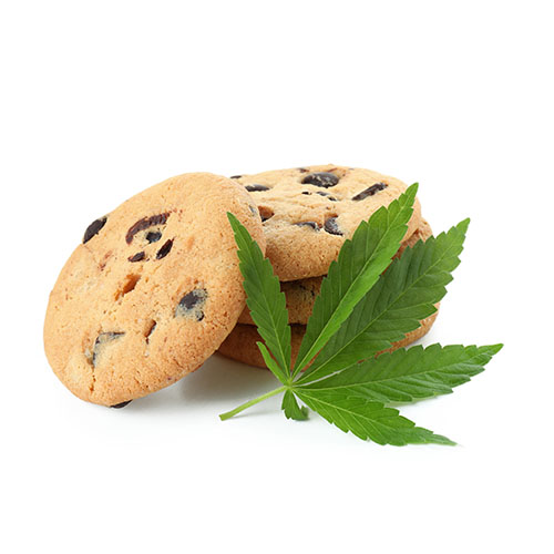 Stack of chocolate chip cookies with cannabis leaf at the base