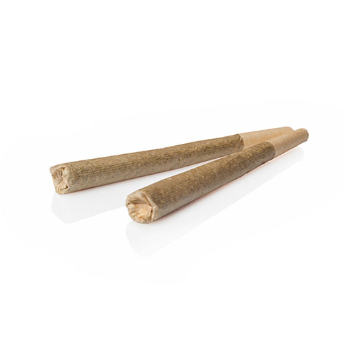 Five cannabis joints laying next to reach other on a black table