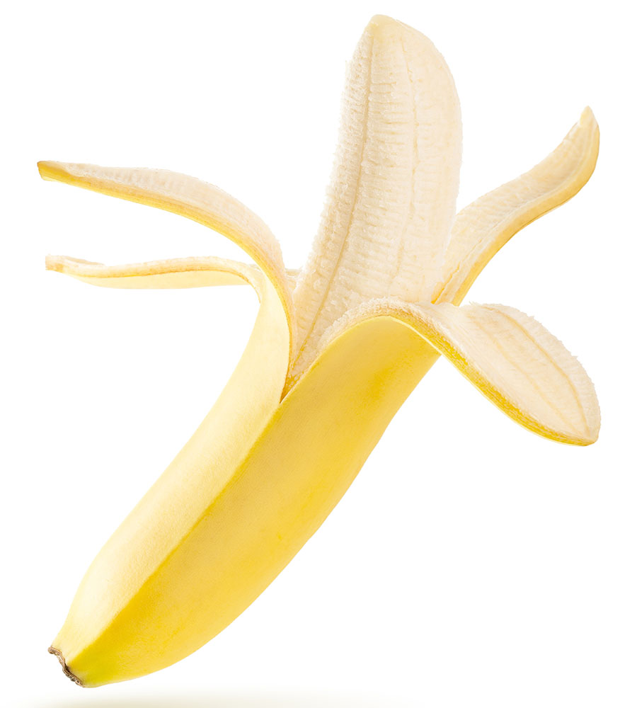 Yellow banana halfway peeled on a white background
