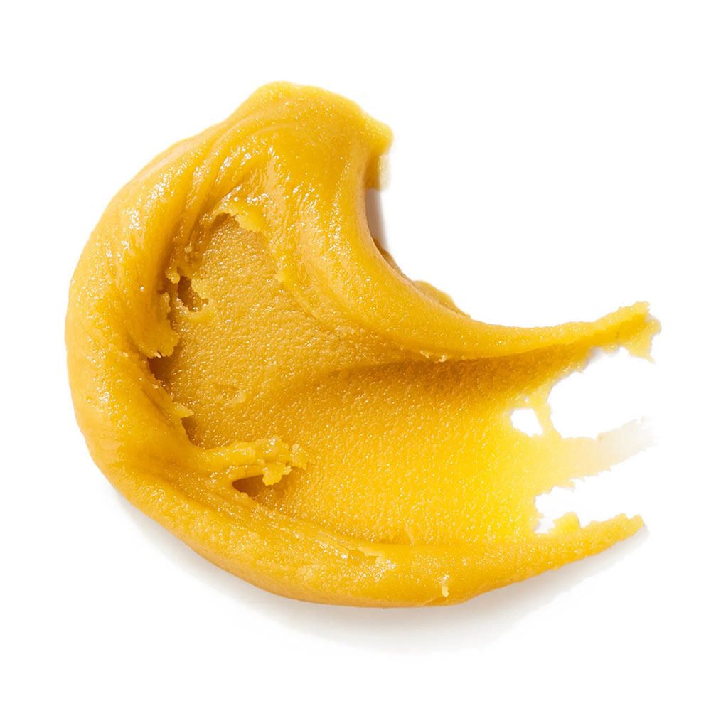 Budder concentrate smeared on a white background