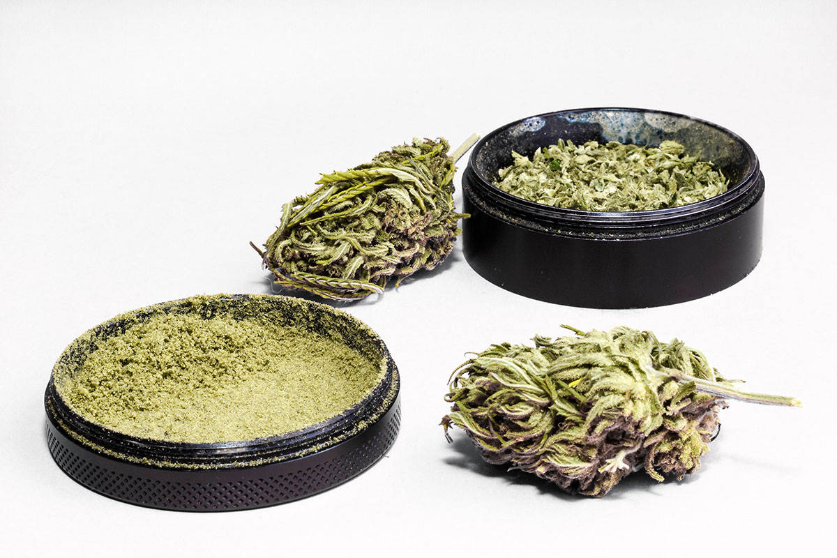 Marijuana grinder disassembled with ground flower