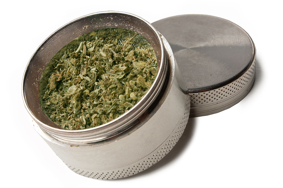 Cannabis grinder with flower inside
