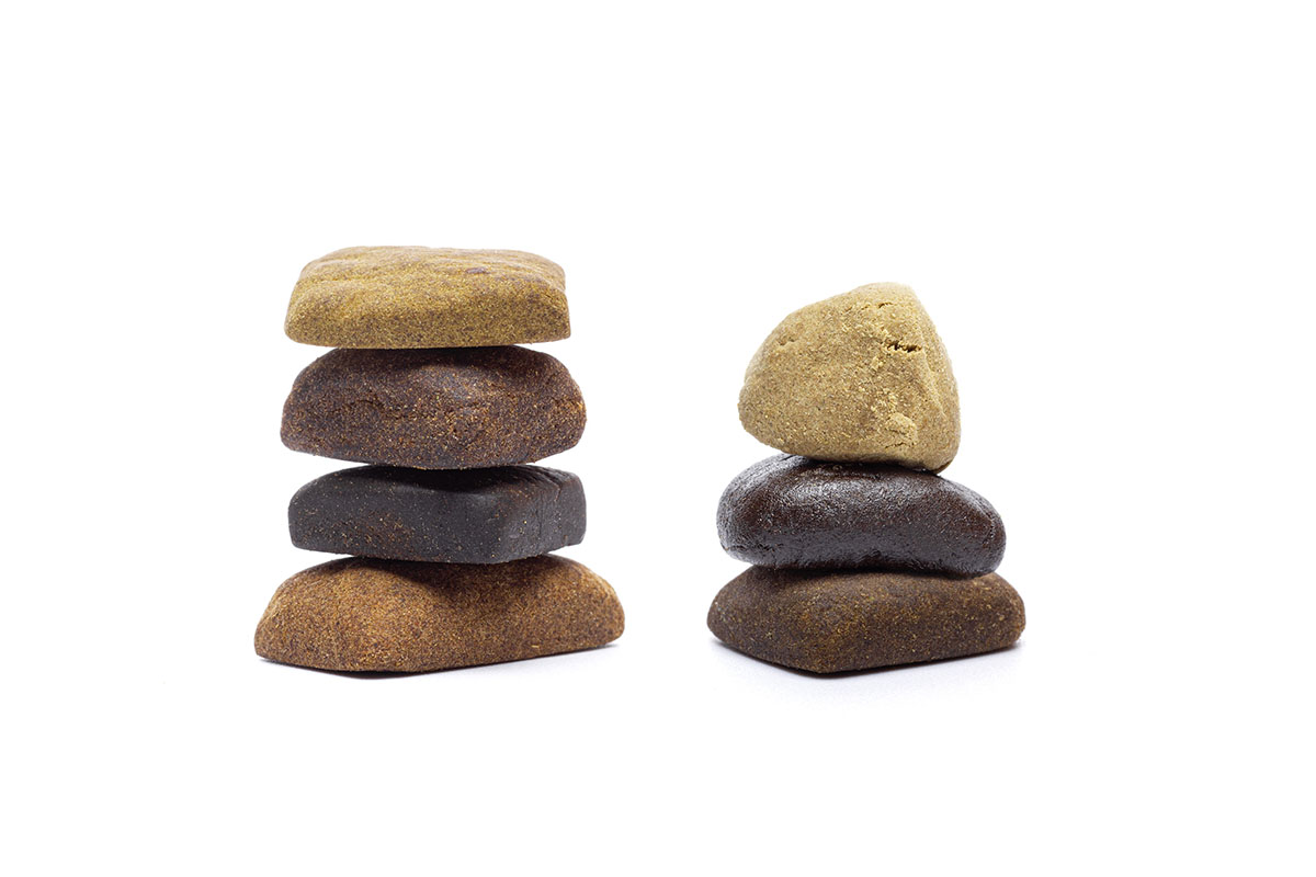 Two stacks of different colored bricks of hash