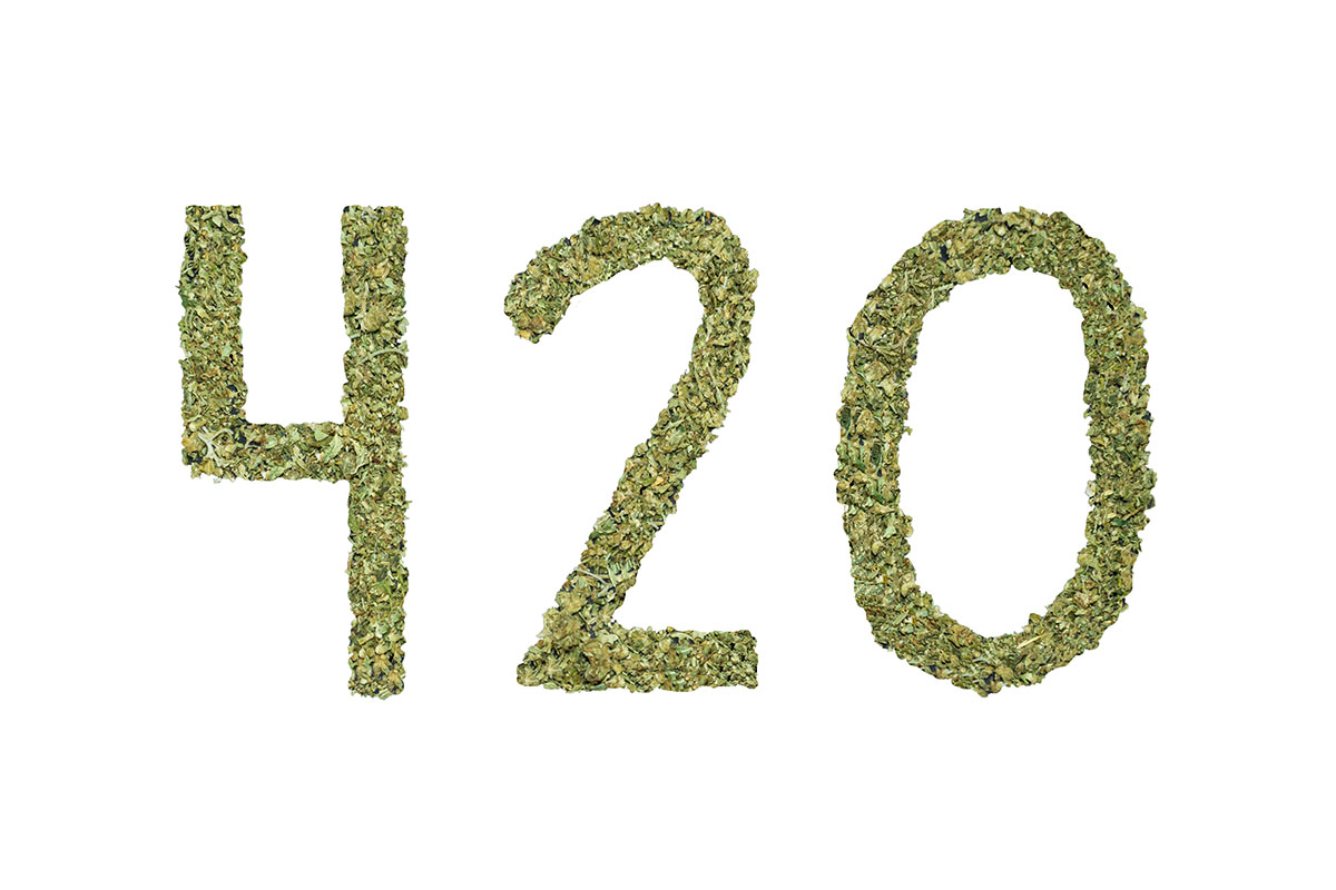 '420' written with kief on a white background