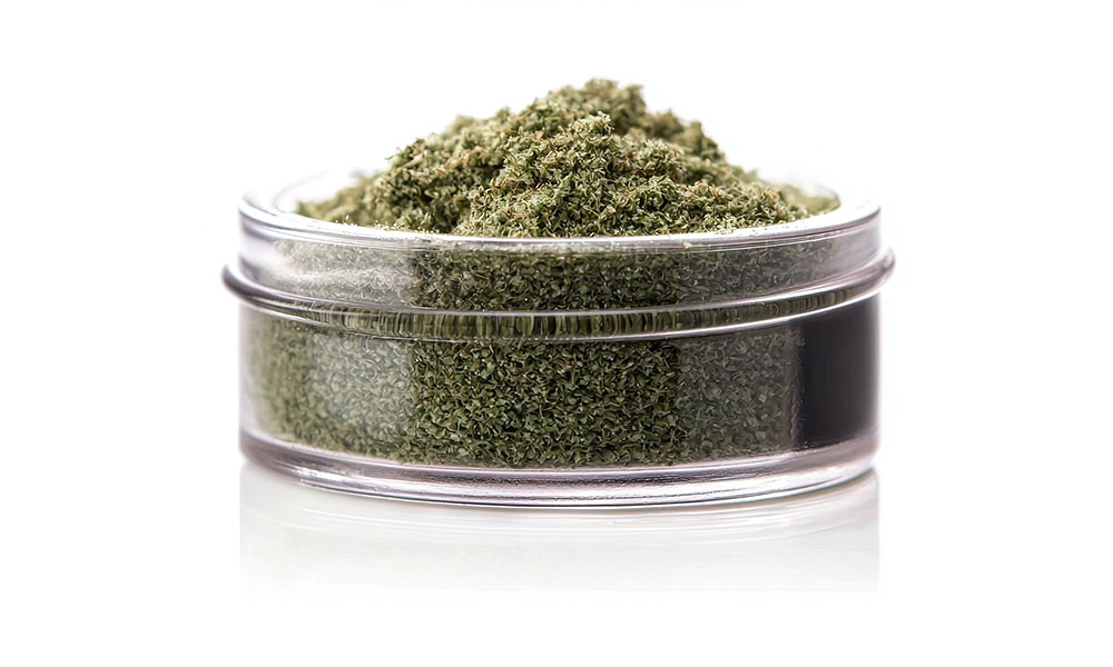 Clear jar filled with kief