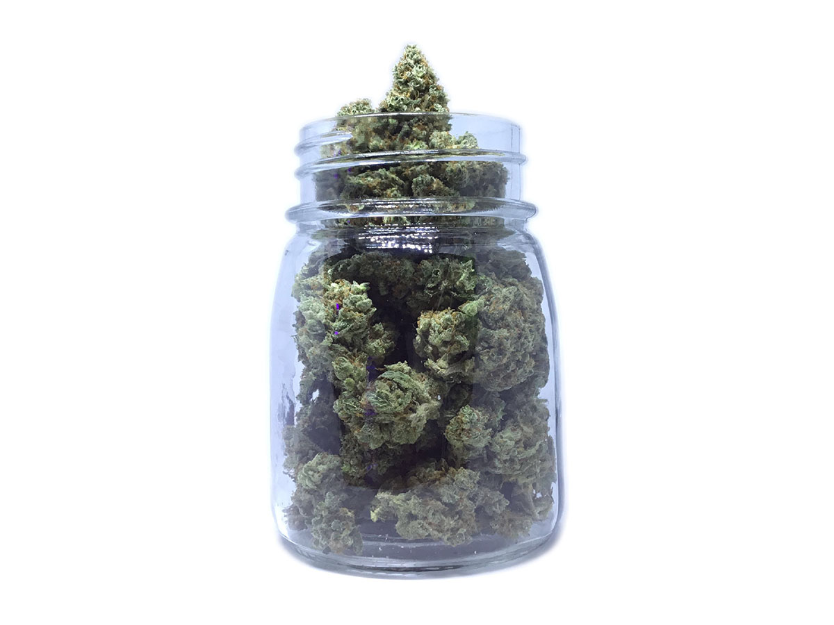 Glass mason jar filled with cannabis flower
