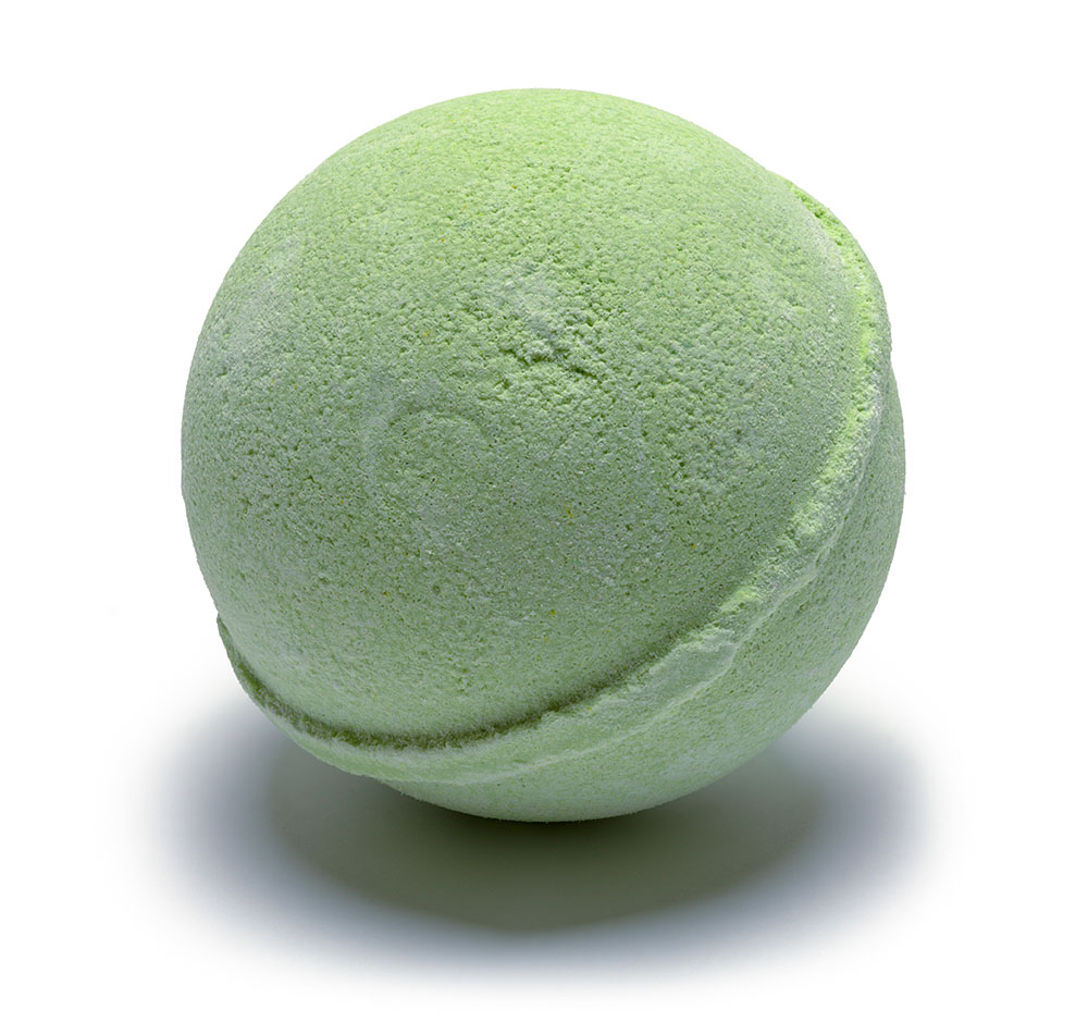 Green bath bomb on a white background
